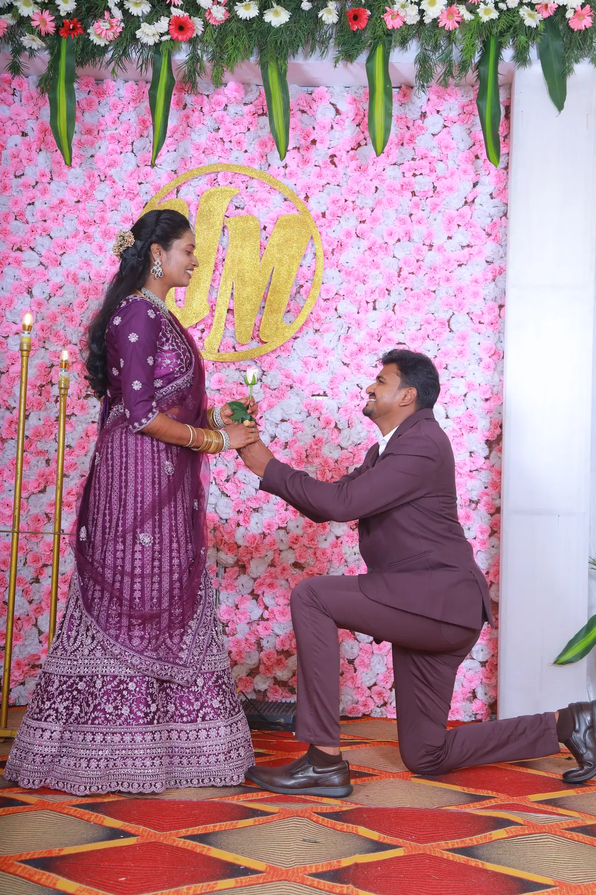 Couple portrait on a floral reception stage