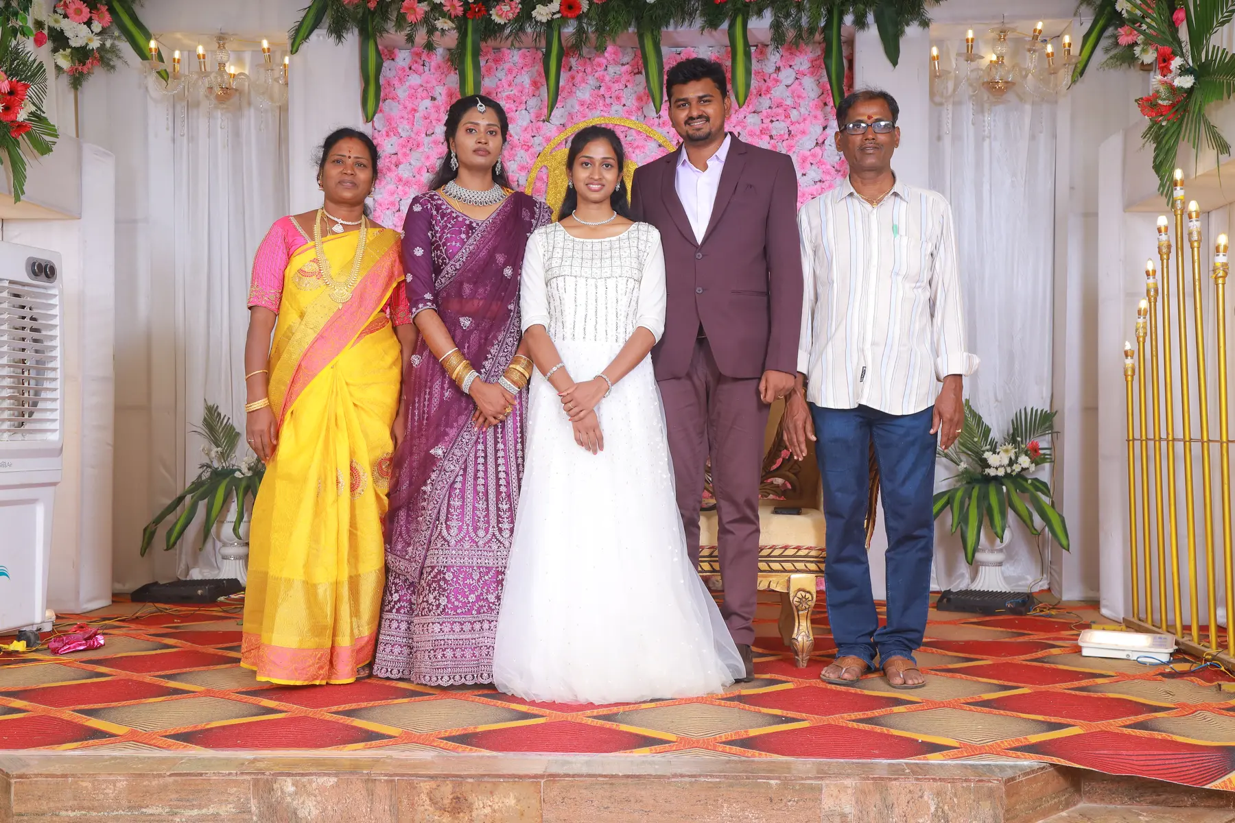 Family group portrait on a reception stage